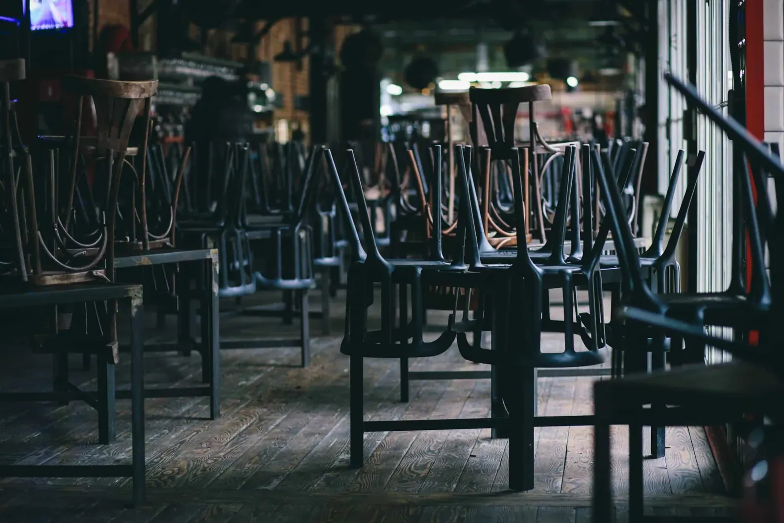 Chairs and tables stacked in a closed pub
