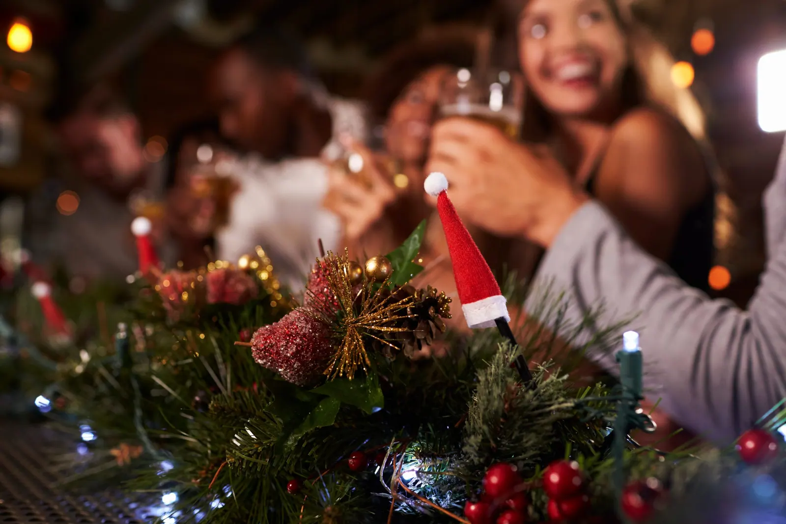 Christmas party at a bar, focus on foreground decorations